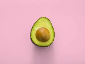 avocado in a pink background